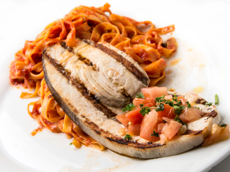 Swordfish (grilled and served with pasta in the picture) is dangerous to eat for the same reason as shark